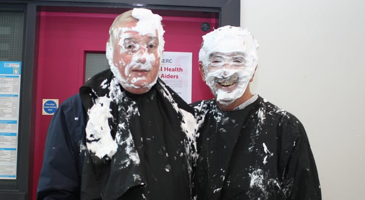 Members of the college management get involved in the pie face event